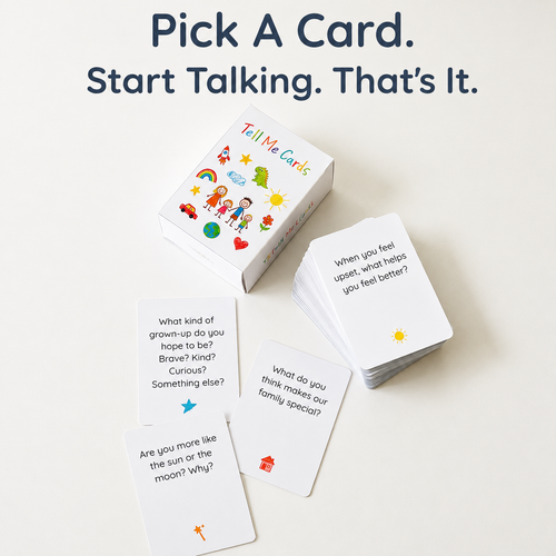 A set of white 'Tell Me Cards' shown with their colorful illustrated box and several sample cards on a light neutral background. Large text at the top reads, 'Pick A Card.