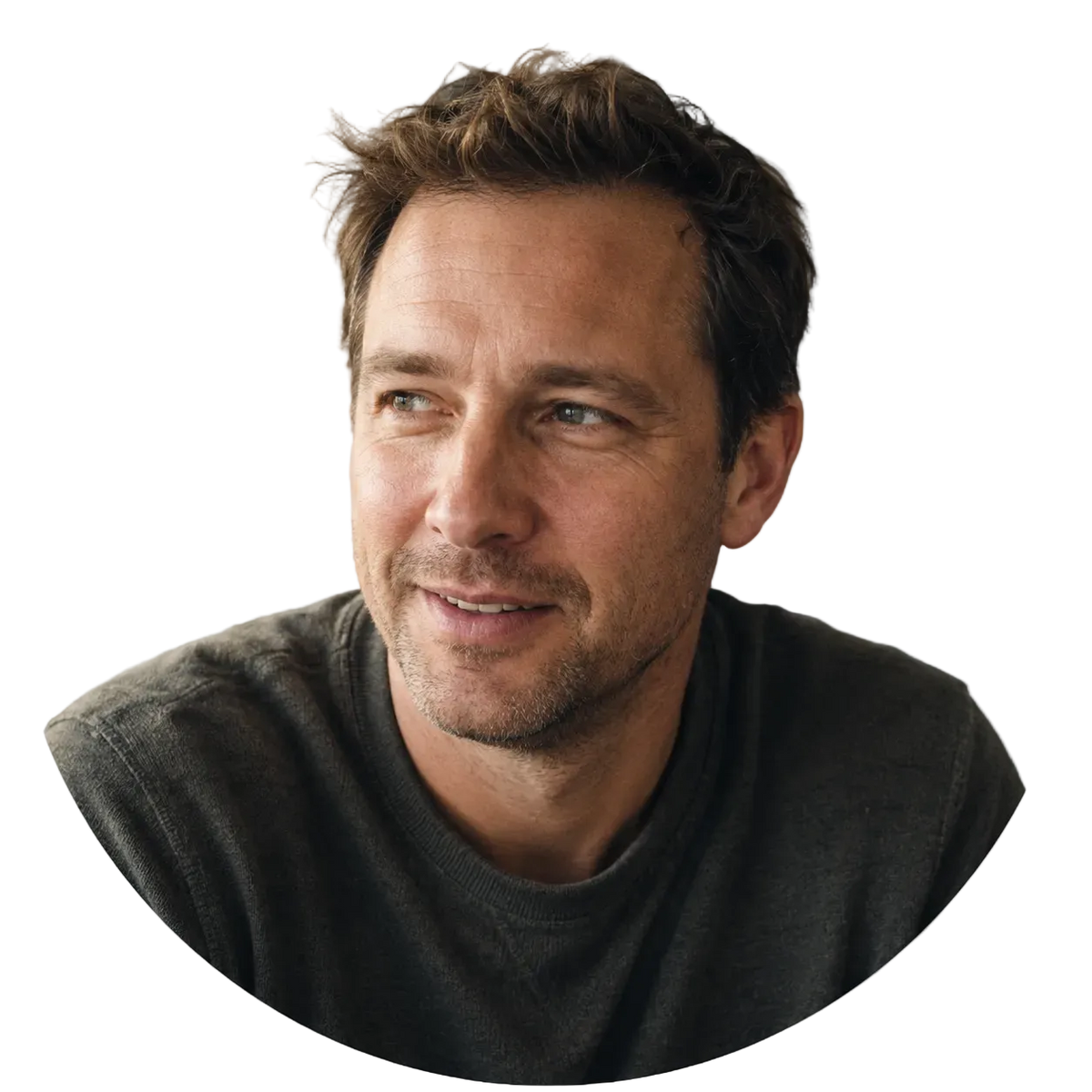 Man with a casual smile in an indoor setting